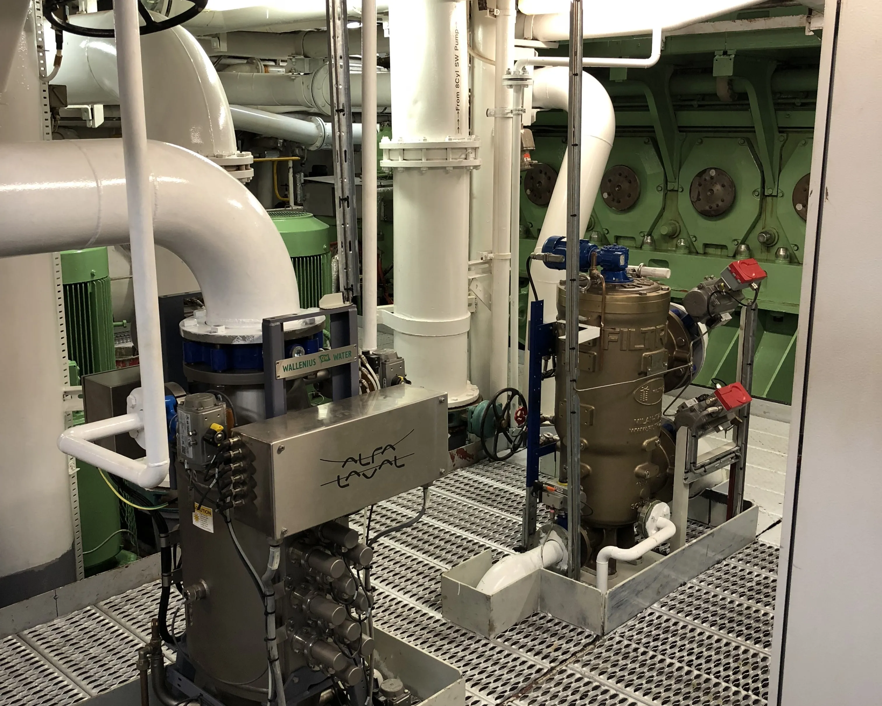 Ballast Water Treatment System surrounded by white-coloured piping