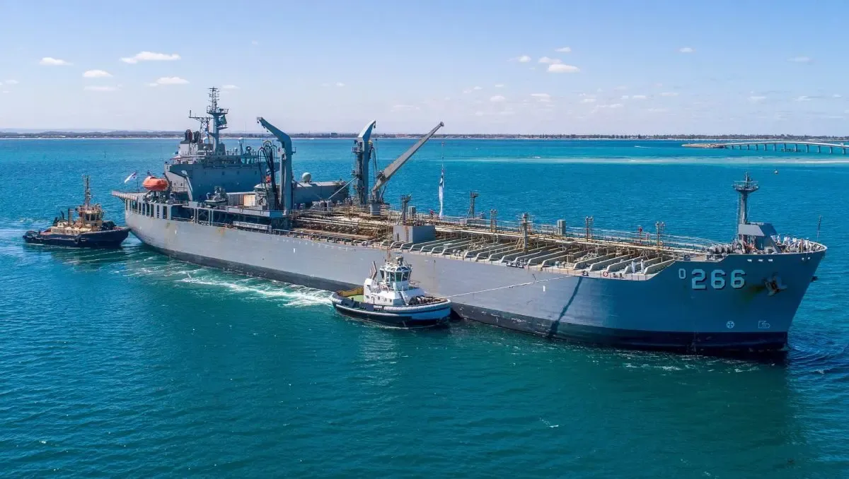 The HMAS Sirius being accompanied by 2 smaller boats in the ocean