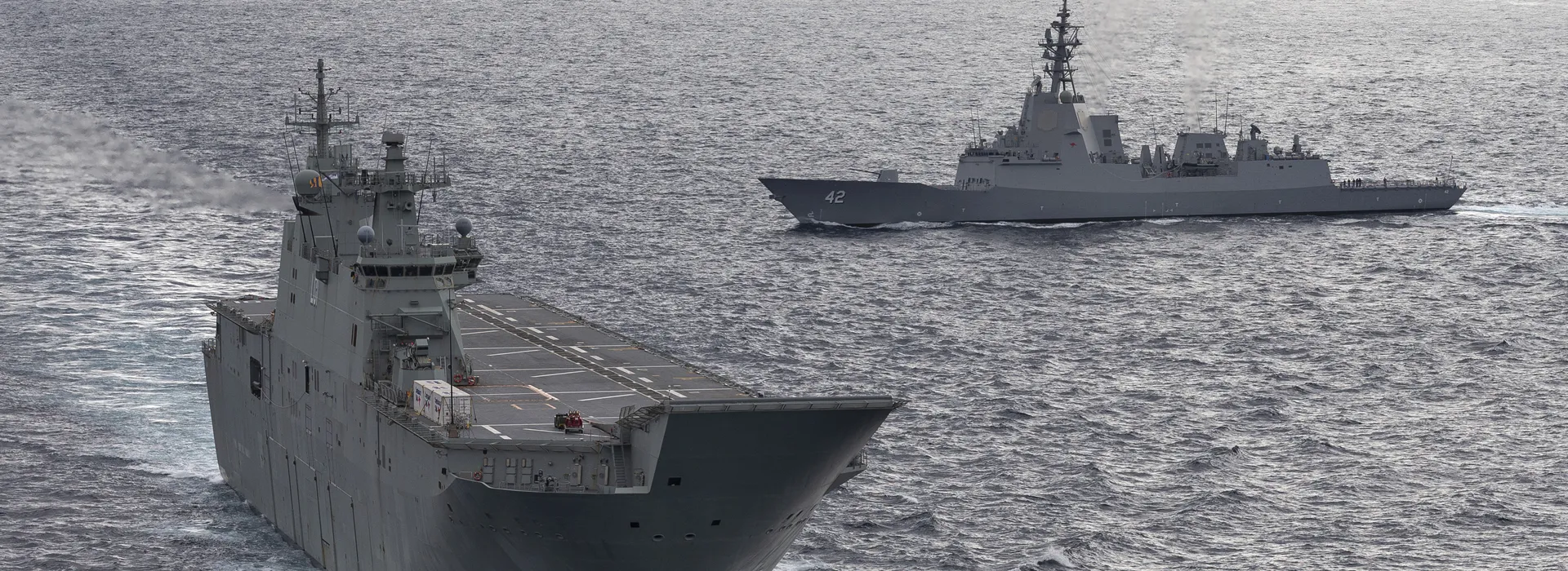 A cruise ship next to Sydney Harbour Bridge